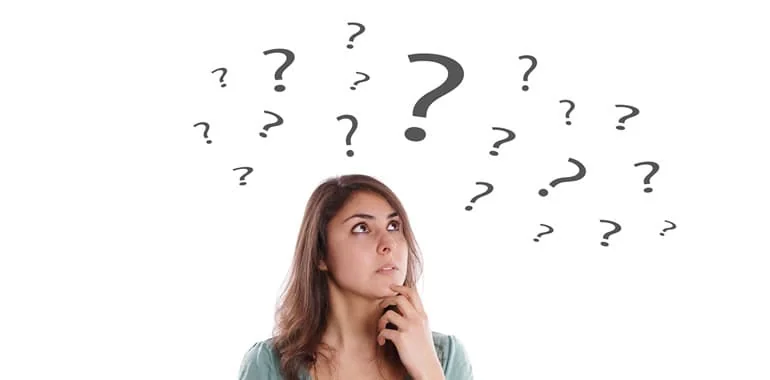 Woman with a thoughtful expression beneath a cloud of question marks