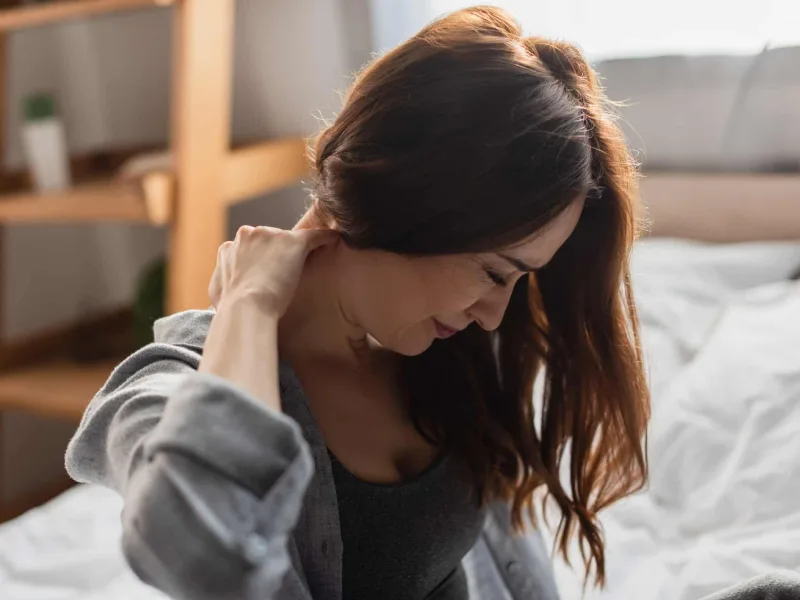 Physical therapist discussing chronic pain management with a patient