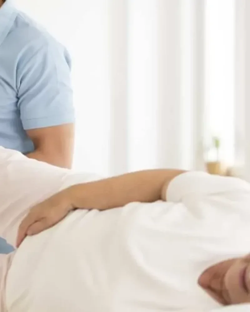 Therapist performing manual therapy and strengthening exercises for hip and knee