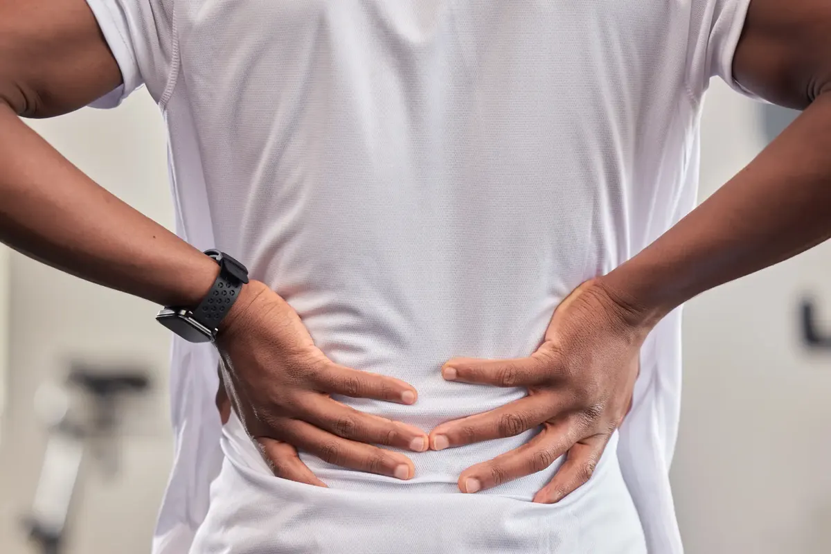 Man holding his lower back in pain